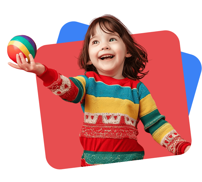 Happy child playing and reaching toward a colorful ball.