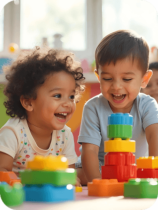 A child happily playing with construction blocks.