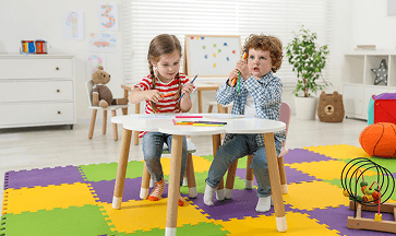 Children taking part in a colorful classroom routine activity.